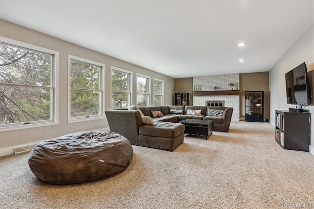 6062 S Emporia Cir, Englewood, CO 80111 - carpeted living area with a brick fireplace and recessed lighting