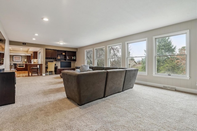 6062 S Emporia Cir, Englewood, CO 80111 - carpeted living area with recessed lighting, visible vents, and plenty of natural light