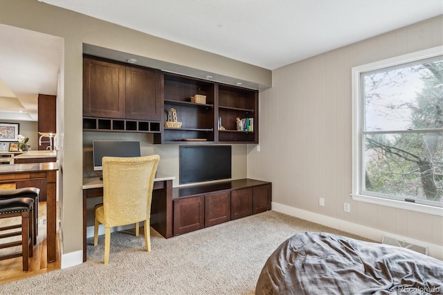 6062 S Emporia Cir, Englewood, CO 80111 - bedroom featuring built in study area, multiple windows, visible vents, and light colored carpet