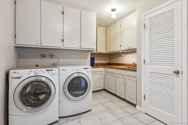 6062 S Emporia Cir, Englewood, CO 80111 - laundry area with a sink, cabinet space, light tile patterned flooring, and washer and dryer