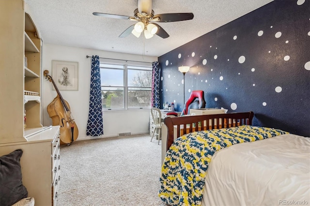 6062 S Emporia Cir, Englewood, CO 80111 - carpeted bedroom featuring visible vents, a ceiling fan, a textured ceiling, and baseboards
