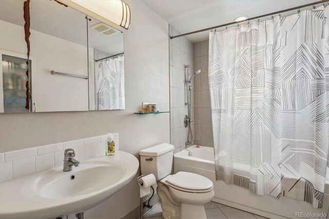 6062 S Emporia Cir, Englewood, CO 80111 - full bath featuring shower / bath combo with shower curtain, tile patterned flooring, visible vents, toilet, and a sink