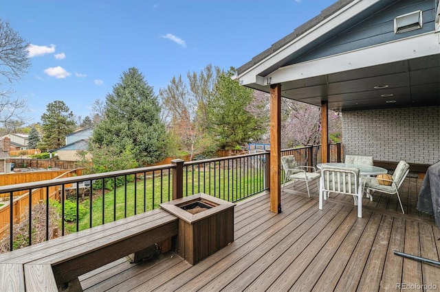6062 S Emporia Cir, Englewood, CO 80111 - deck with outdoor dining area, a fenced backyard, and a lawn
