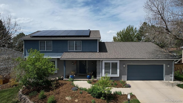 6062 S Emporia Cir, Englewood, CO 80111 - traditional home with covered porch, a tiled roof, brick siding, concrete driveway, and an attached garage