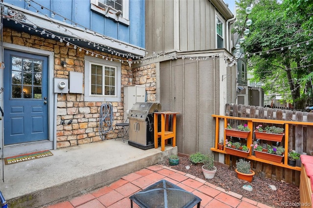 8108 S Fillmore Cir, Centennial, CO 80122 - doorway to property featuring stone siding and board and batten siding