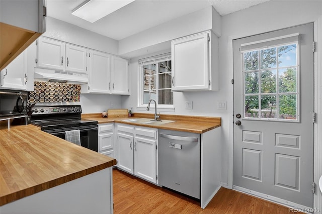 8108 S Fillmore Cir, Centennial, CO 80122 - kitchen with black appliances, butcher block countertops, premium range hood, white cabinetry, and light wood-type flooring