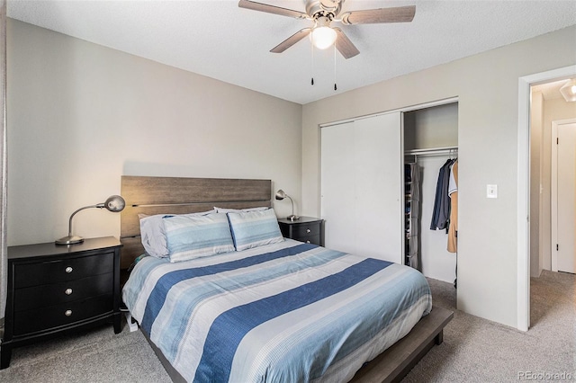 bedroom featuring carpet floors, a closet, and ceiling fan