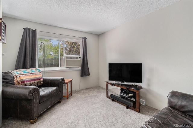 living room featuring carpet floors, a textured ceiling, and cooling unit