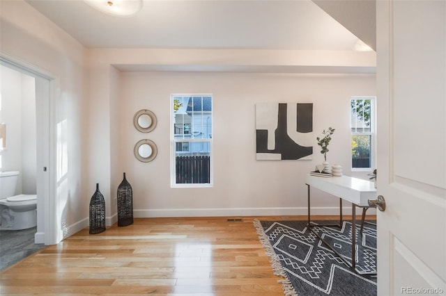 office space with hardwood / wood-style floors