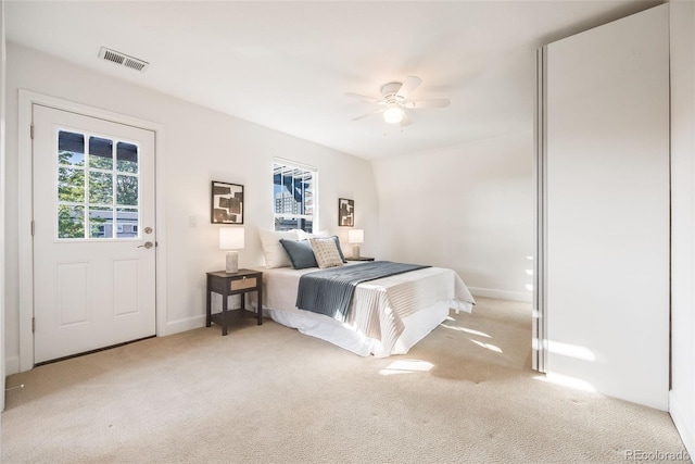 carpeted bedroom featuring ceiling fan