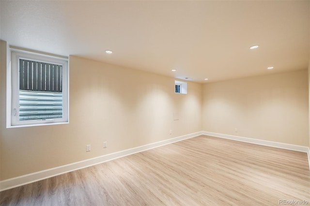 empty room with light hardwood / wood-style flooring