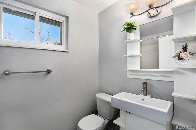 bathroom featuring sink and toilet