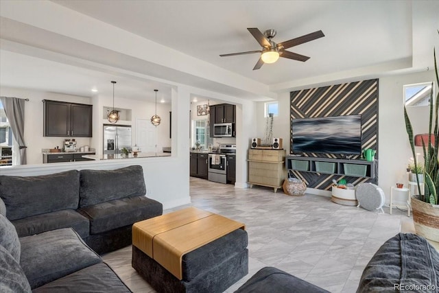 239 S Old Hammer St, Aurora, CO 80018 - living room with a ceiling fan and baseboards