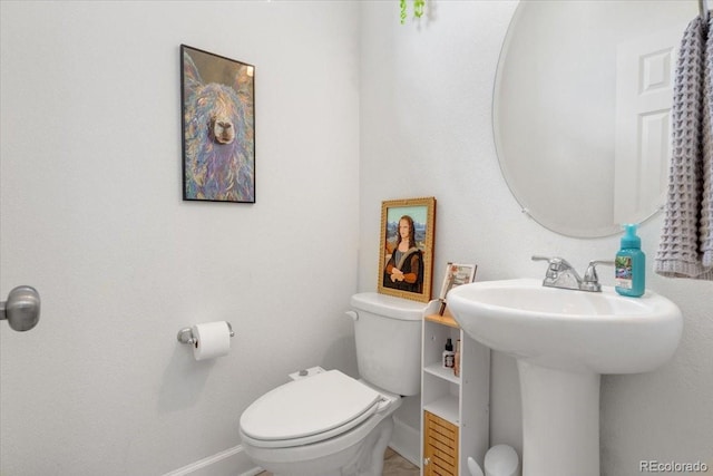 239 S Old Hammer St, Aurora, CO 80018 - bathroom with baseboards and toilet
