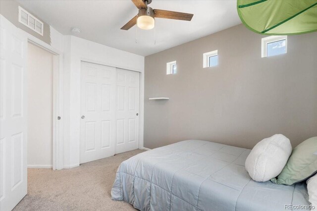 239 S Old Hammer St, Aurora, CO 80018 - bedroom featuring multiple windows, carpet flooring, a closet, and a ceiling fan
