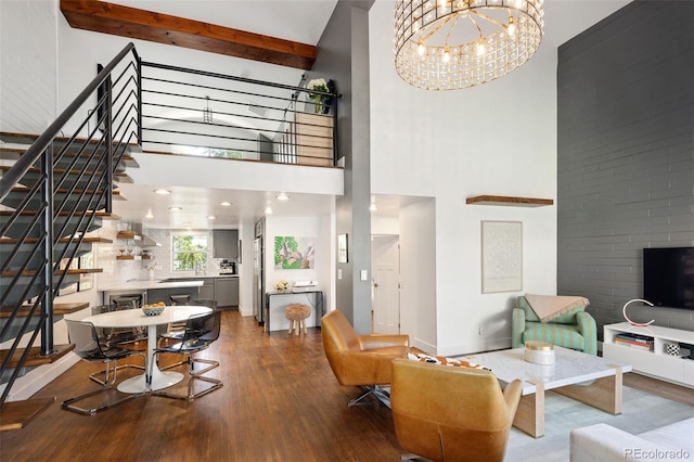 505 Detroit St, Denver, CO 80206 - living area featuring a high ceiling, wood finished floors, stairs, beamed ceiling, and a chandelier