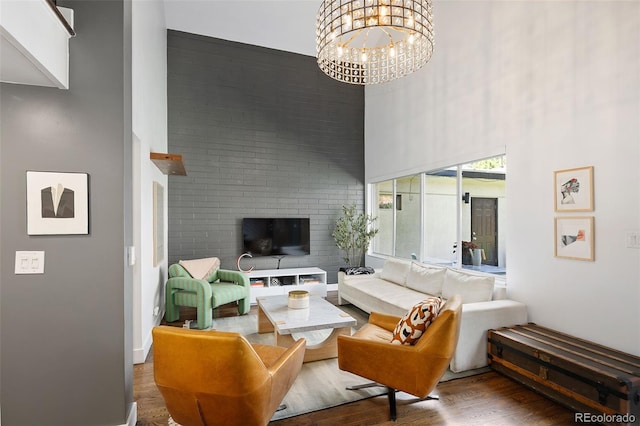 505 Detroit St, Denver, CO 80206 - living area with wood finished floors, a high ceiling, and a chandelier