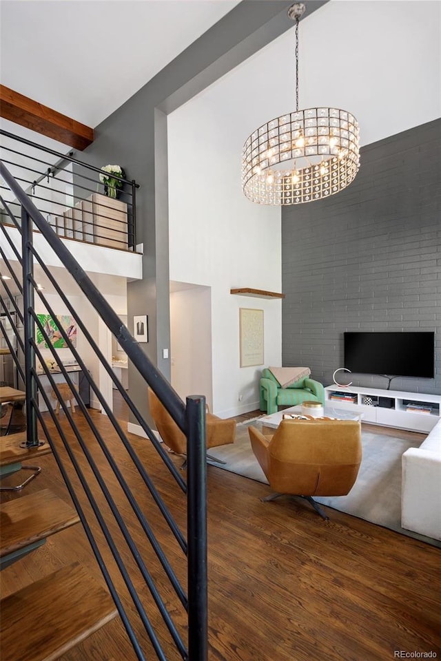 505 Detroit St, Denver, CO 80206 - stairs featuring wood finished floors, a chandelier, and a high ceiling