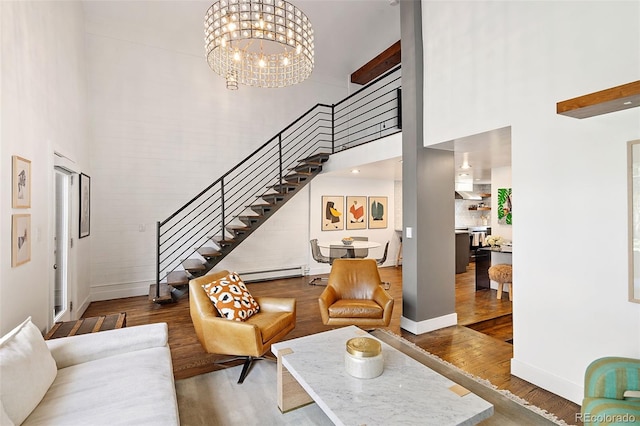 505 Detroit St, Denver, CO 80206 - living area featuring a towering ceiling, stairs, wood finished floors, baseboard heating, and a chandelier