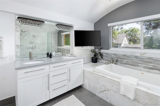 505 Detroit St, Denver, CO 80206 - bathroom featuring a bath, double vanity, vaulted ceiling, and a stall shower