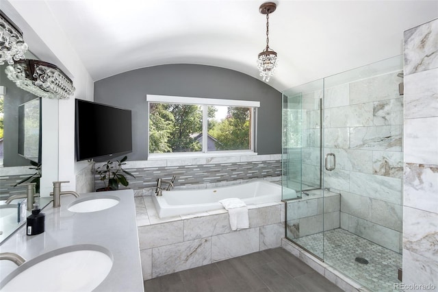 505 Detroit St, Denver, CO 80206 - bathroom featuring a bath, a shower stall, double vanity, vaulted ceiling, and wood finished floors