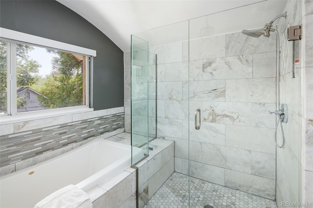 505 Detroit St, Denver, CO 80206 - full bathroom featuring lofted ceiling, a garden tub, and a shower stall