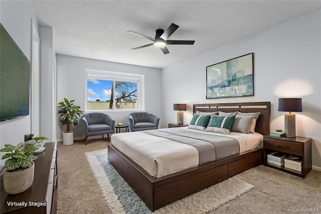 bedroom with ceiling fan and light carpet