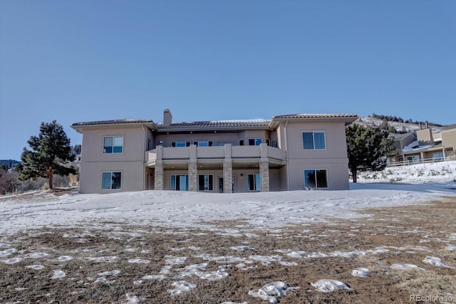 view of snow covered house