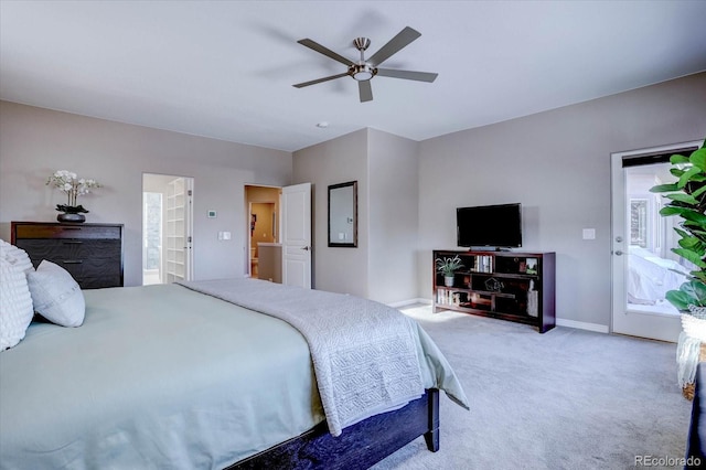 carpeted bedroom featuring access to exterior and ceiling fan