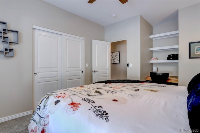 carpeted bedroom with ceiling fan and a closet