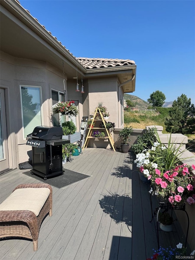 wooden deck with area for grilling