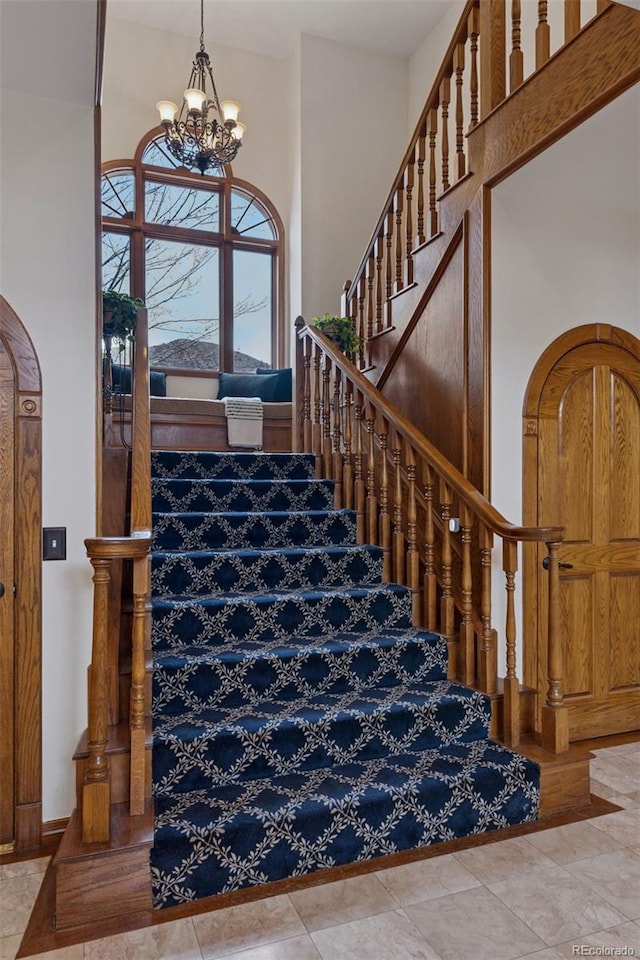 5 Tamarade Dr, Littleton, CO 80127 - staircase with a chandelier and a high ceiling