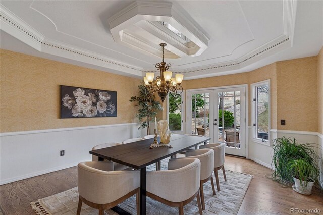 5 Tamarade Dr, Littleton, CO 80127 - dining space featuring french doors, a tray ceiling, wainscoting, and wallpapered walls