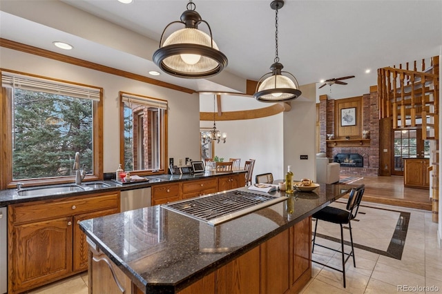 5 Tamarade Dr, Littleton, CO 80127 - kitchen with a brick fireplace, a sink, recessed lighting, ceiling fan with notable chandelier, and stainless steel dishwasher
