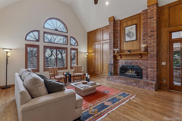 5 Tamarade Dr, Littleton, CO 80127 - living area with high vaulted ceiling, a fireplace, and light wood-style floors