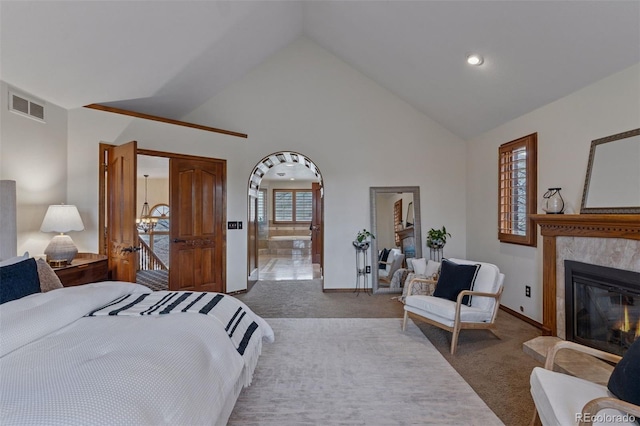 5 Tamarade Dr, Littleton, CO 80127 - bedroom featuring high vaulted ceiling, visible vents, carpet floors, a tiled fireplace, and baseboards