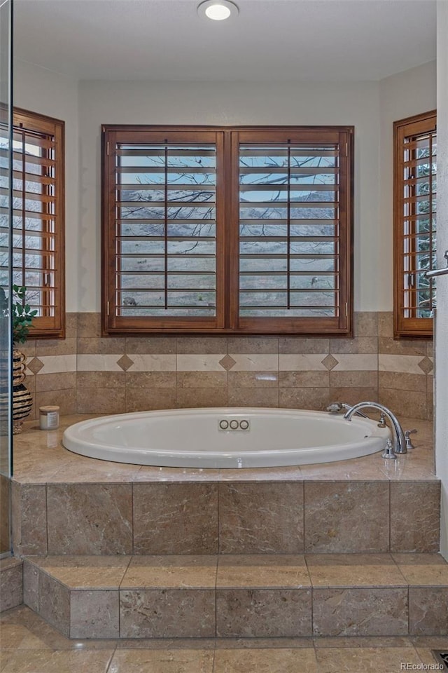 5 Tamarade Dr, Littleton, CO 80127 - bathroom featuring a bath and a wealth of natural light