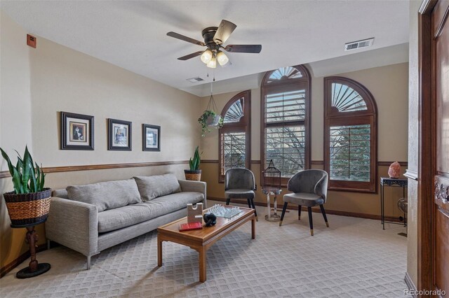5 Tamarade Dr, Littleton, CO 80127 - living room featuring carpet, visible vents, baseboards, and a ceiling fan