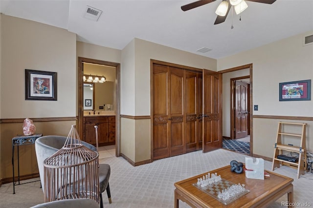 5 Tamarade Dr, Littleton, CO 80127 - living room featuring light colored carpet, a ceiling fan, and visible vents