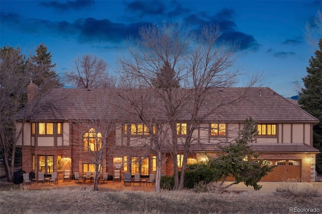 5 Tamarade Dr, Littleton, CO 80127 - rear view of property with a patio, stucco siding, and brick siding