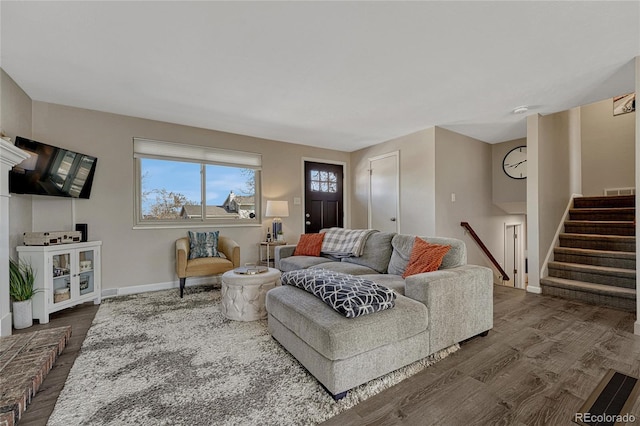 living room with baseboards, stairway, and dark wood-style flooring