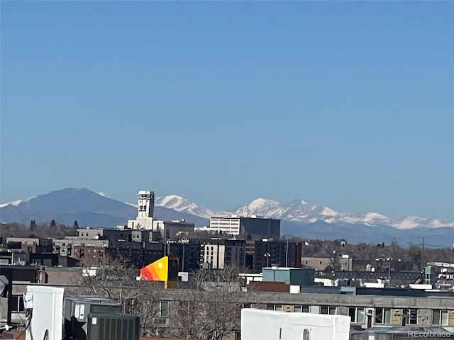 property's view of city with a mountain view