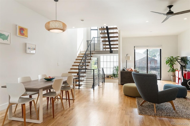 dining space featuring light wood-type flooring, stairs, a ceiling fan, and recessed lighting