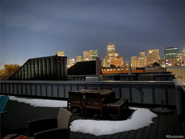 deck at twilight with a view of city lights