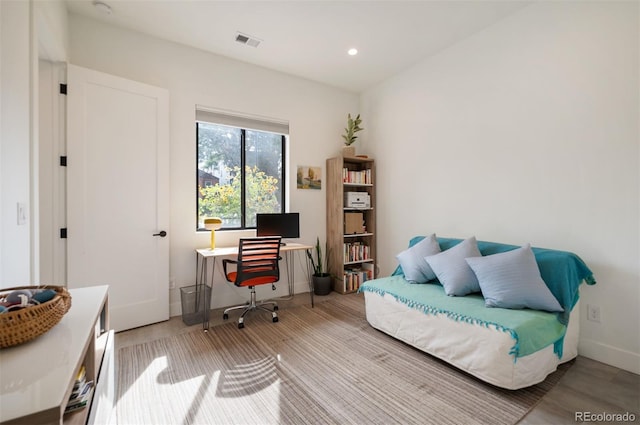 home office with recessed lighting, visible vents, and baseboards