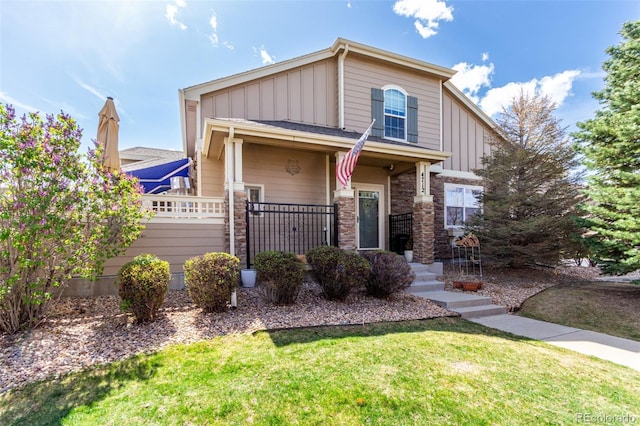 4712 Raven Run, Broomfield, CO 80023 - view of front of property featuring a front lawn, fence, and board and batten siding