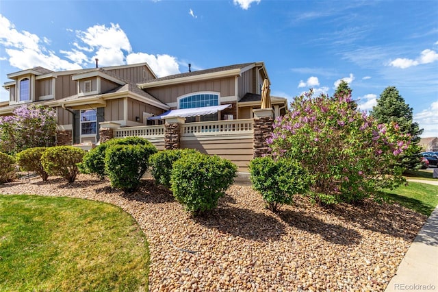 4712 Raven Run, Broomfield, CO 80023 - view of front of house with board and batten siding and fence
