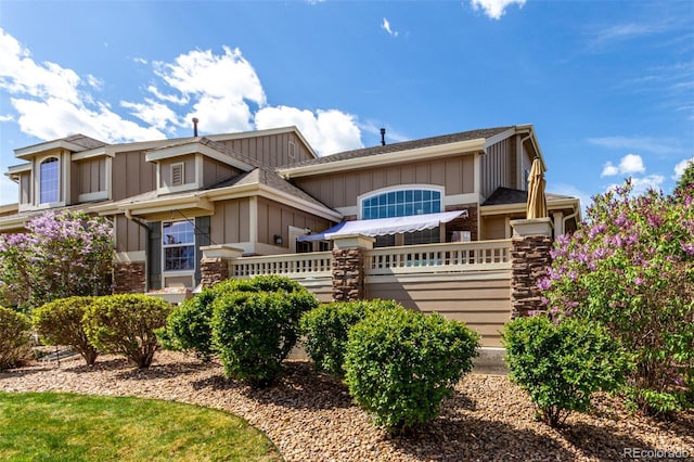 4712 Raven Run, Broomfield, CO 80023 - view of front of house featuring board and batten siding and fence