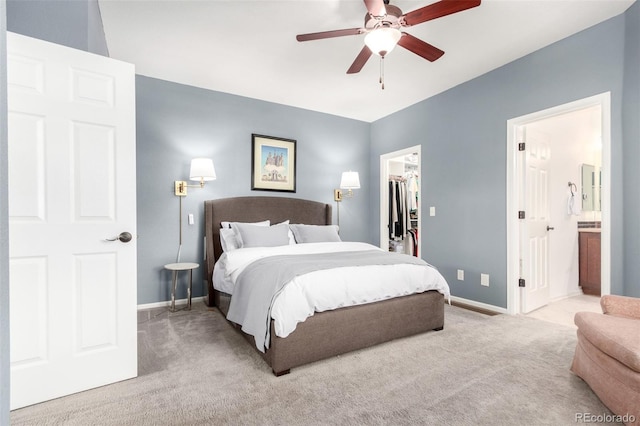 4712 Raven Run, Broomfield, CO 80023 - bedroom with baseboards, carpet, a closet, connected bathroom, and a walk in closet