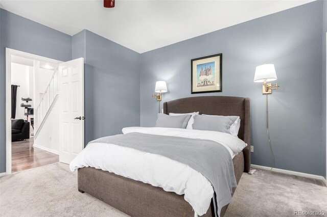 4712 Raven Run, Broomfield, CO 80023 - carpeted bedroom with a ceiling fan and baseboards